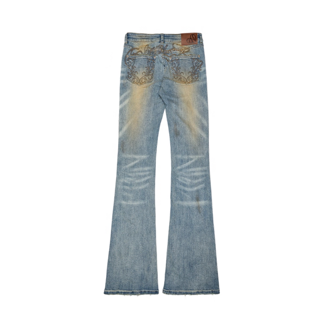 MUD-DYED WASHED DENIM FLARED PANTS