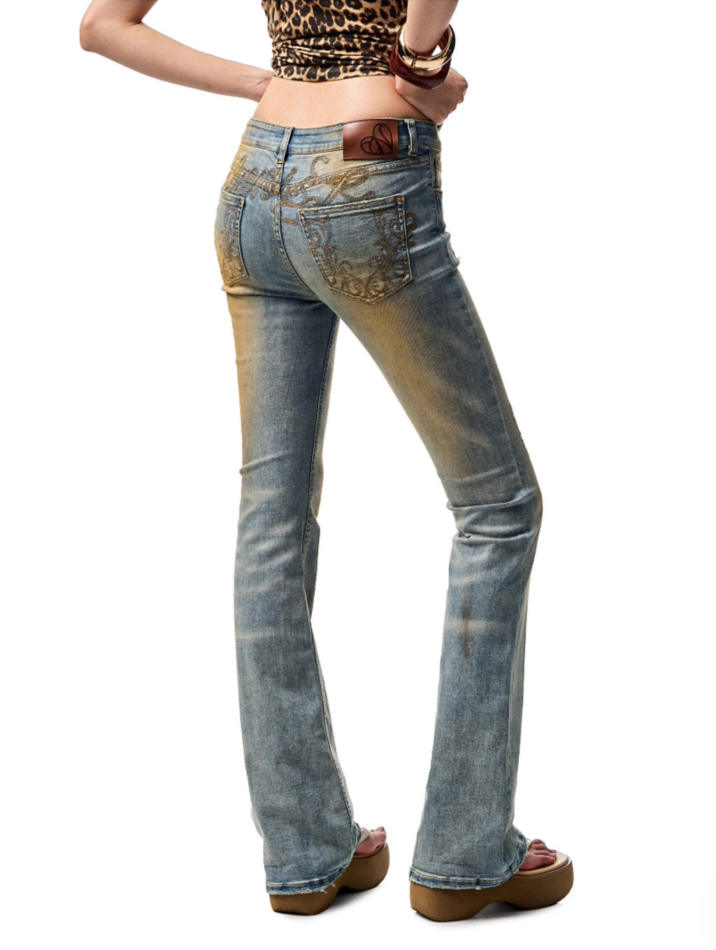 MUD-DYED WASHED DENIM FLARED PANTS